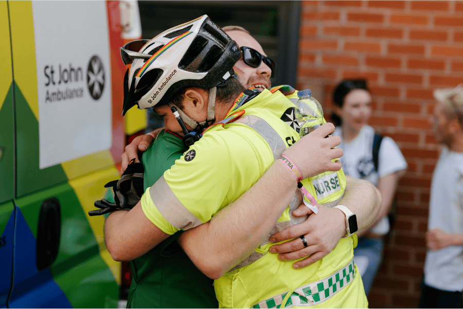 St John Ambulance volunteer hugging patient