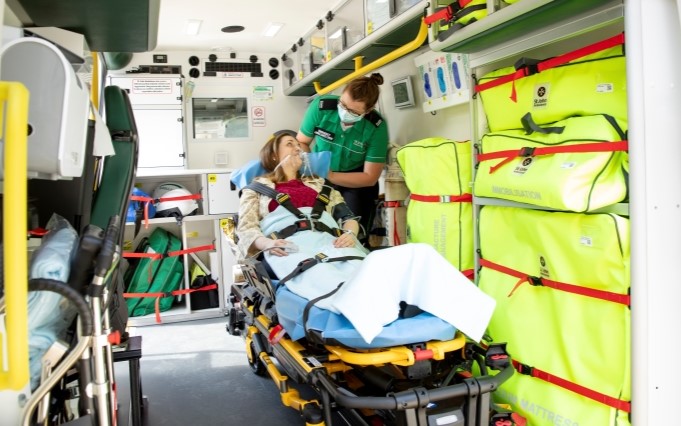 Volunteer and patient in ambulance small pod