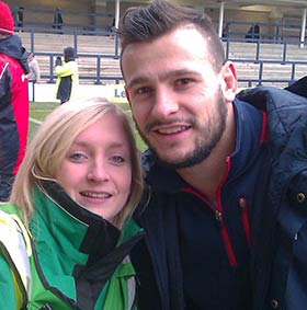 Student volunteer Emma Cooper with Danny Care Student volunteer Emma Cooper with Danny Care from the England Rugby Team