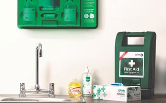 First aid room showing first aid kit, eye wash station and gloves