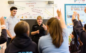 Teaching first aid to a class of school pupils