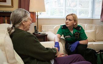 Community First Responder reassuring elderly woman