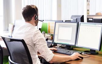 Man sitting in front of a computer screen